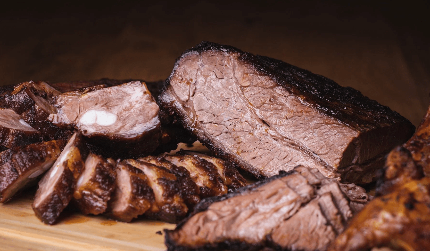 Smoked brisket and ribs on cutting board